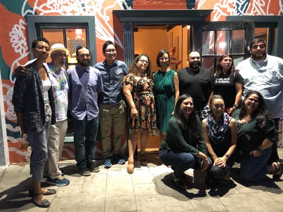 Group photo of writers and organizers for the Fresno event outside the Back Room of at the Revue

